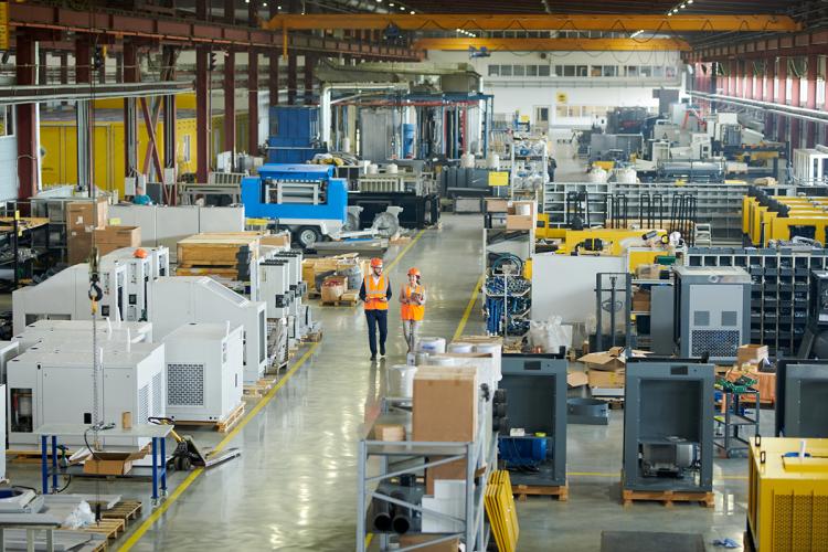 Industrial Warehouse with Staff walking in aisle