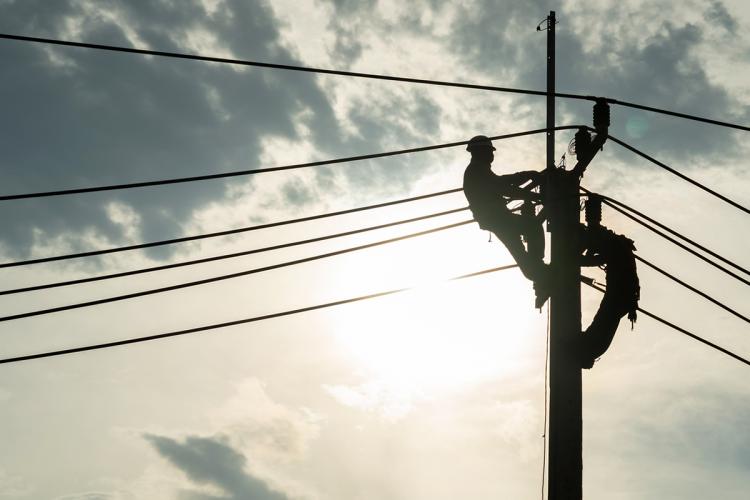 Worker on utility pole